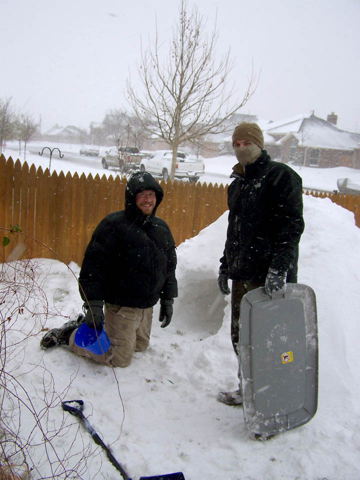 the older boys finish the igloo